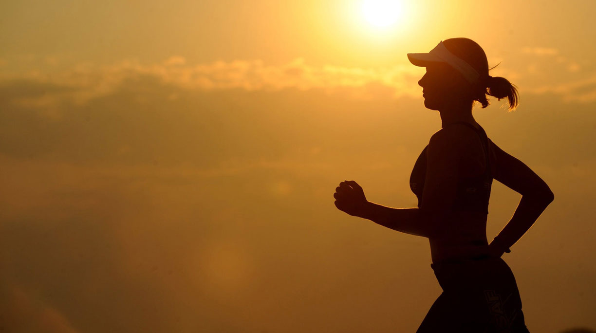 Woman jogging during sunset